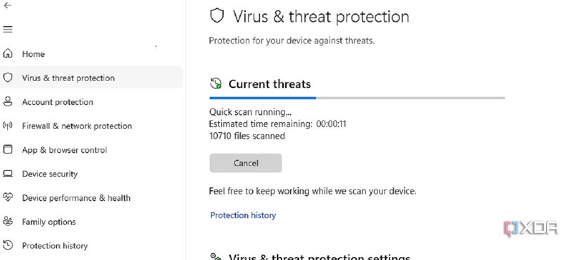 A screenshot showing an on-going Virus and threat protection scan in Windows Security.