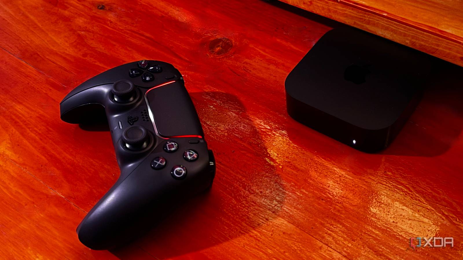 Sony DualSense controller next to Apple TV