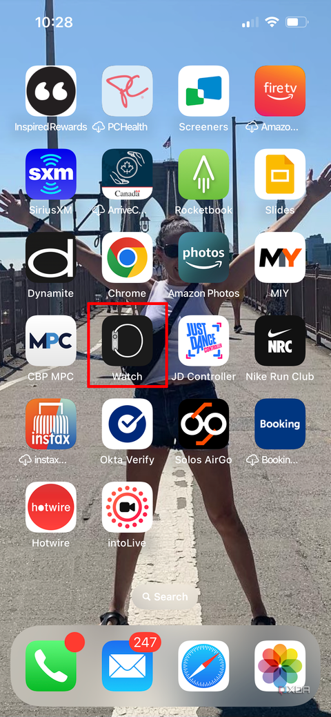 Apple iPhone home screen with the Apple Watch app selected.