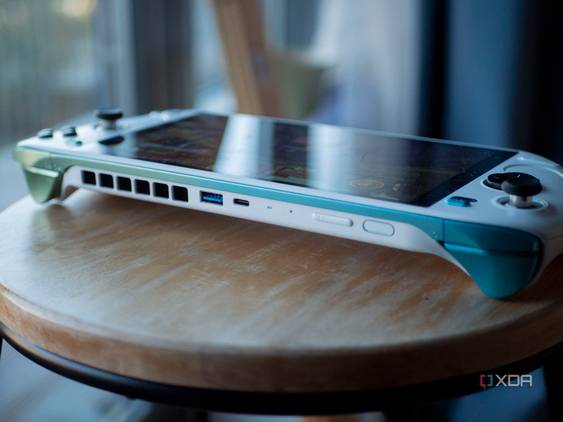 Ayaneo Kun on a stool with USB-A port, USB-C port, fingerprint sensor, and volume rocker