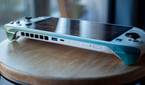 Ayaneo Kun on a stool with USB-A port, USB-C port, fingerprint sensor, and volume rocker