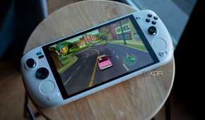 Ayaneo Kun sitting flat on a stool with Simpsons Hit and Run on screen