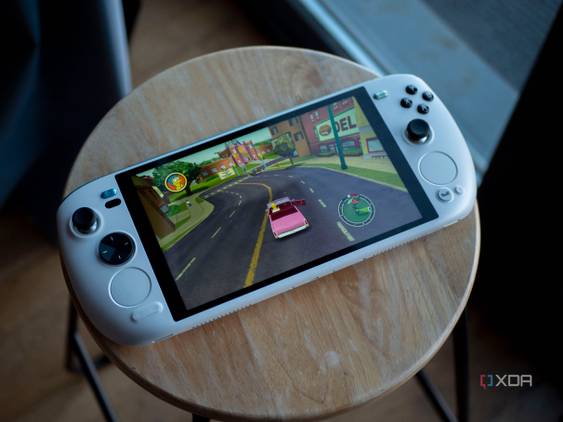 Ayaneo Kun sitting flat on a stool with Simpsons Hit and Run on screen