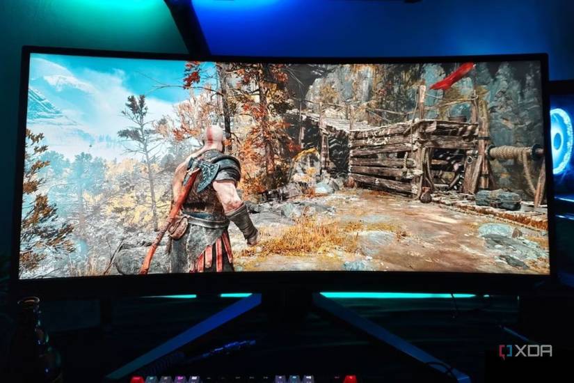 An image showing a Benq Mobiuz ex3415r ultrawide monitor displaying God Of War gameplay.