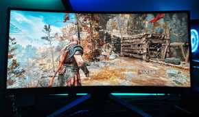 An image showing a Benq Mobiuz ex3415r ultrawide monitor displaying God Of War gameplay.