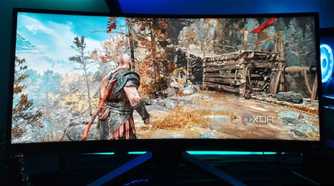 An image showing a Benq Mobiuz ex3415r ultrawide monitor displaying God Of War gameplay.