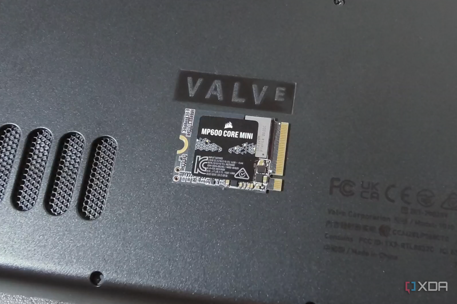 Corsair MP600 Core Mini SSD next to the Valve logo on the Steam Deck.