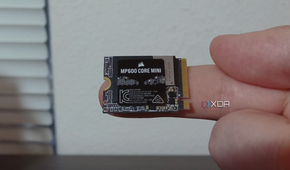 Corsair MP600 Core Mini SSD on a finger.