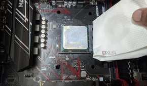 An image of the Ryzen 5 1600 processor with a paper towel dipped in isopropyl alcohol