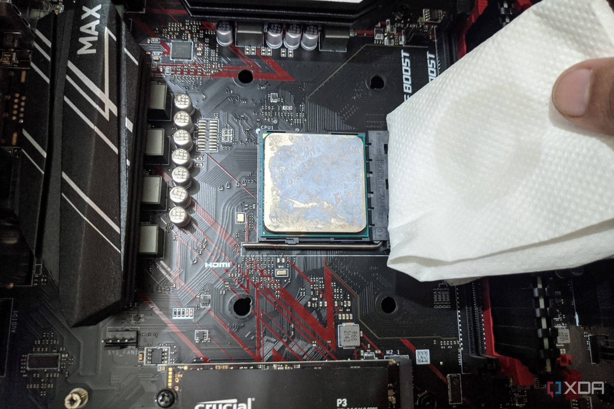 An image of the Ryzen 5 1600 processor with a paper towel dipped in isopropyl alcohol