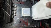 An image of the Ryzen 5 1600 processor with a paper towel dipped in isopropyl alcohol