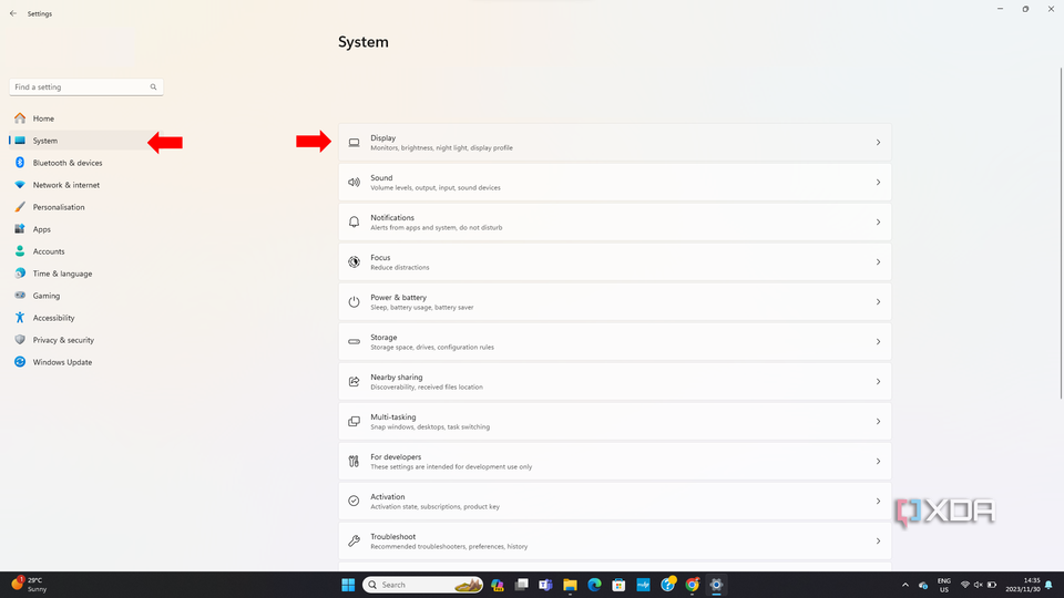 Windows System settings with a menu for Display, Sound, Notifications, Focus, Power & Battery, and other system settings.