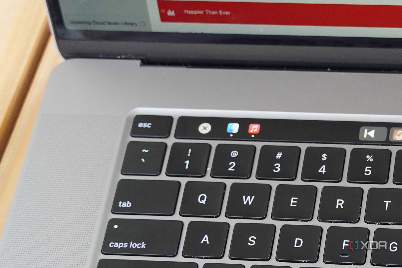 Active apps in the Dock on macOS shown on the Touch Bar.