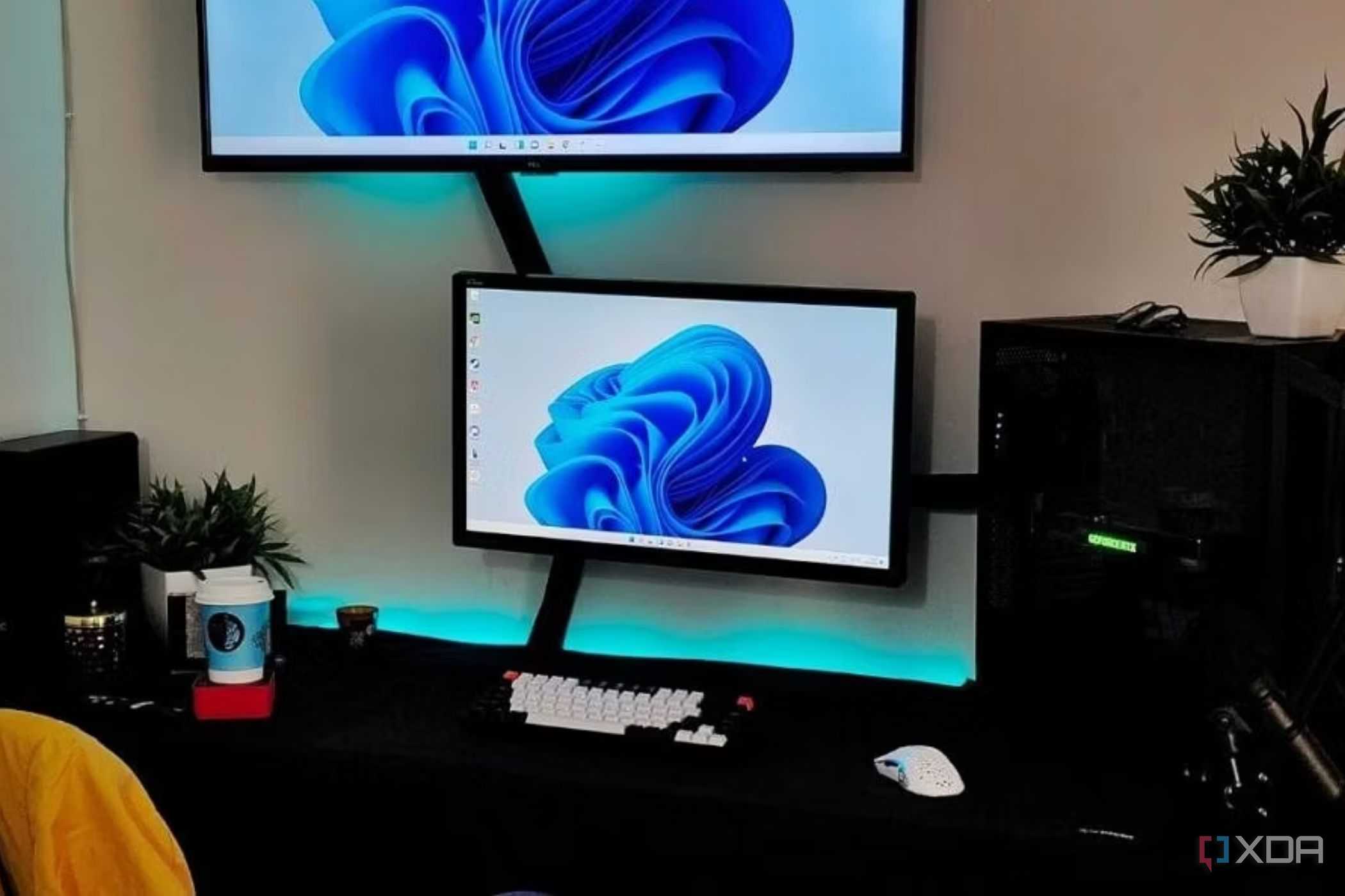 An image showing a dual monitor setup with lots of cables running around the setup.