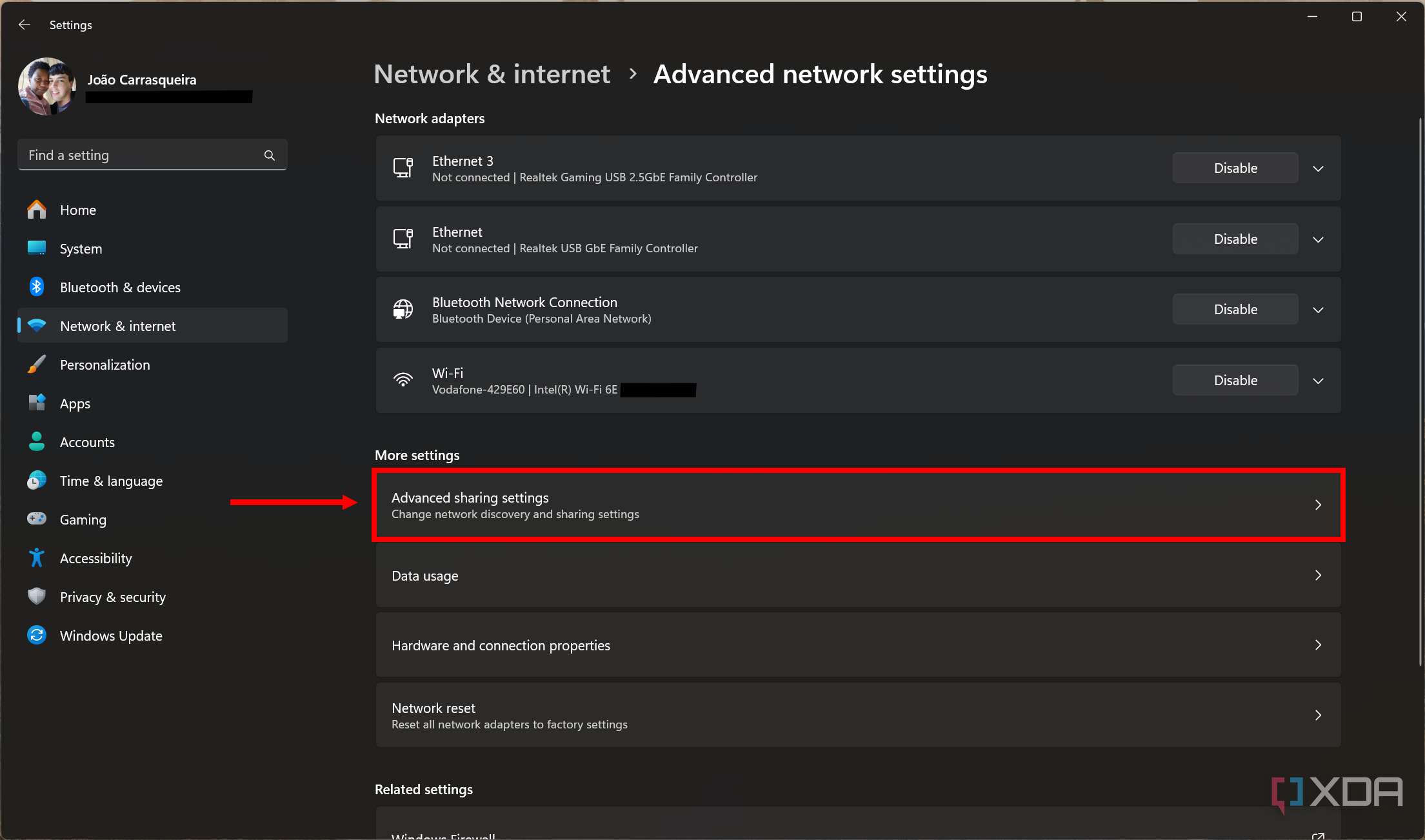 Screenshot of advanced network settings in Windows 11 with the advanced sharing settings button highlighted