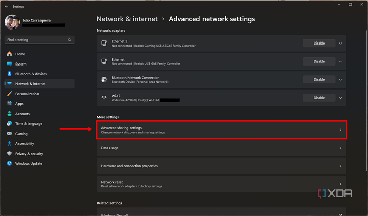 Screenshot of advanced network settings in Windows 11 with the advanced sharing settings button highlighted