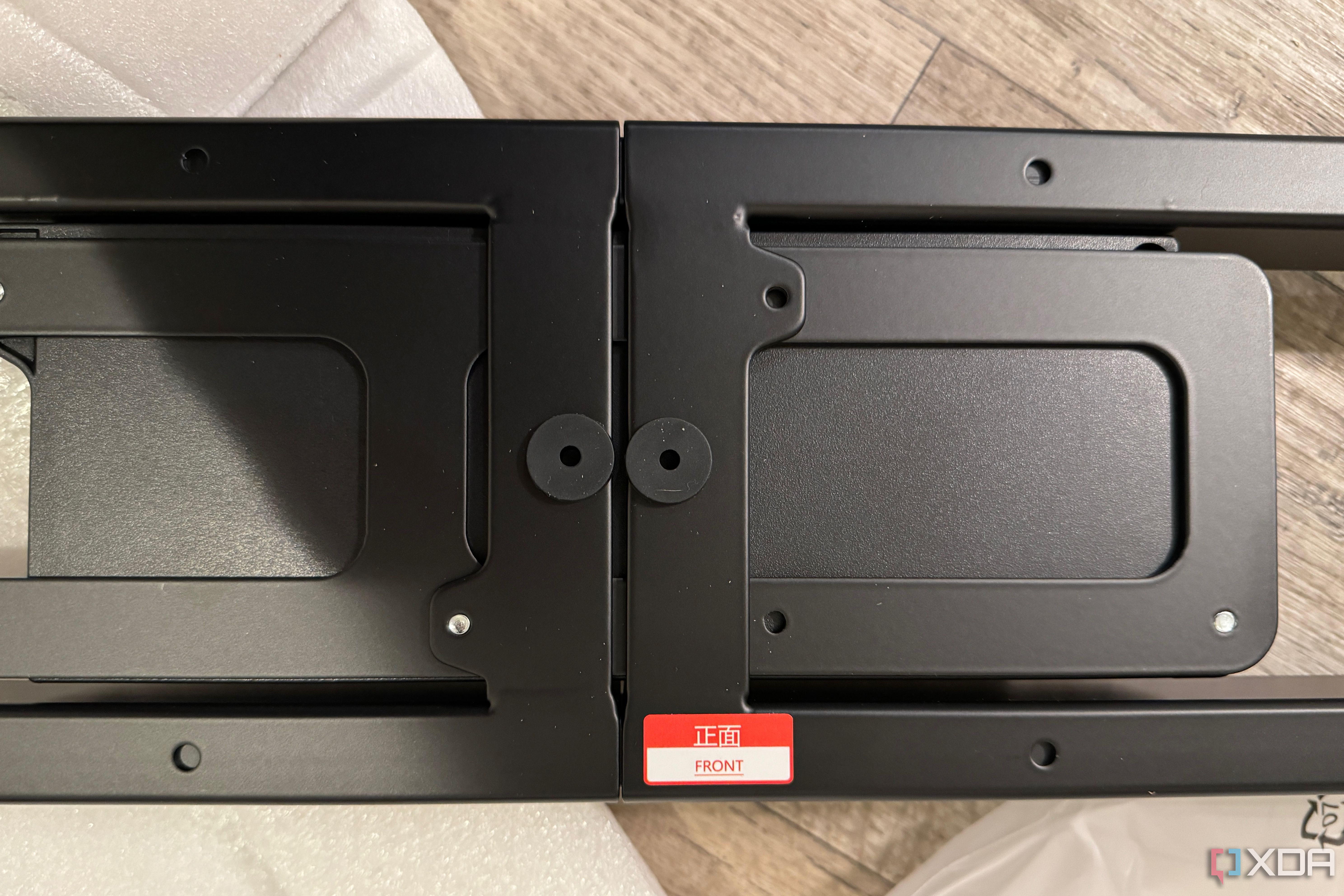 The length adjustment bracket for a FlexiSpot desk.