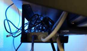 The cable management tray included on the FlexiSpot standing desk.