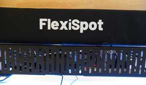 The FlexiSpot cable management tray and sleeve.