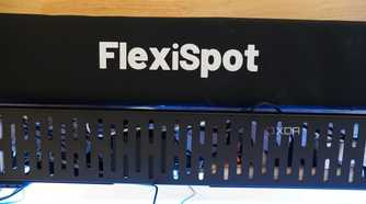 The FlexiSpot cable management tray and sleeve.