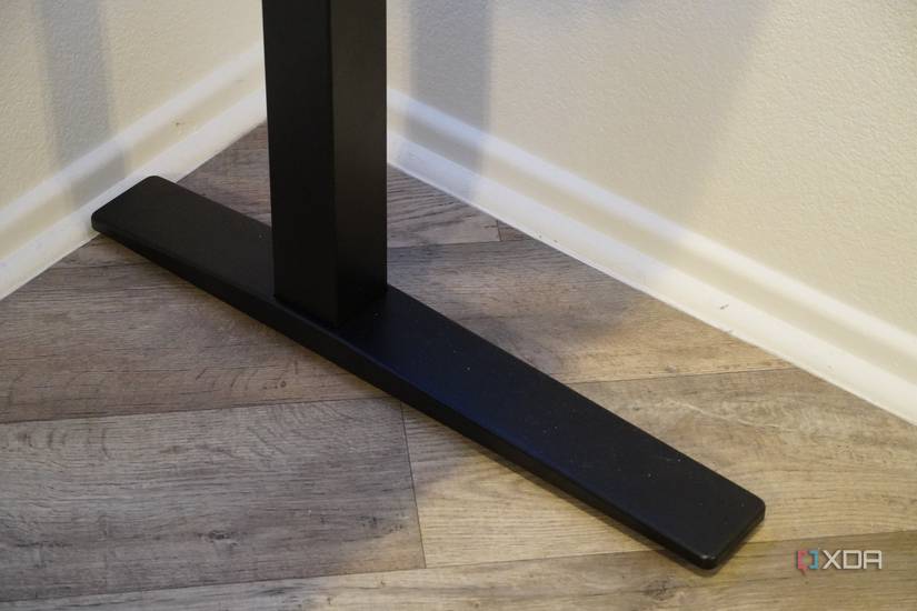 The feet and legs of a FlexiSpot desk.