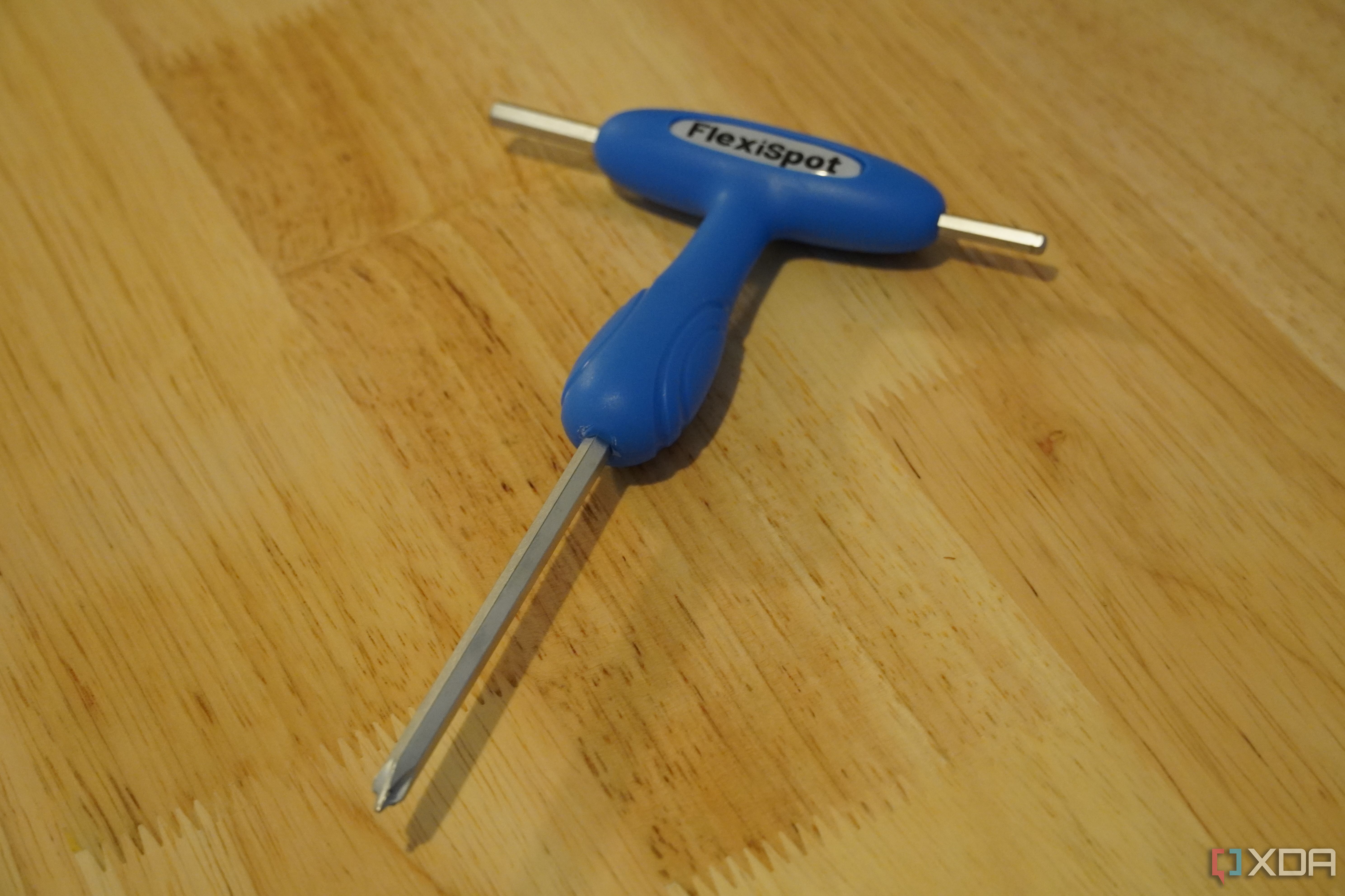 The FlexiSpot screwdriver tool.