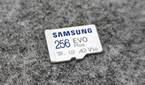 An image showing the front side of a microsd card kept on a felt pad.
