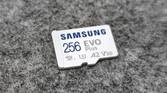 An image showing the front side of a microsd card kept on a felt pad.