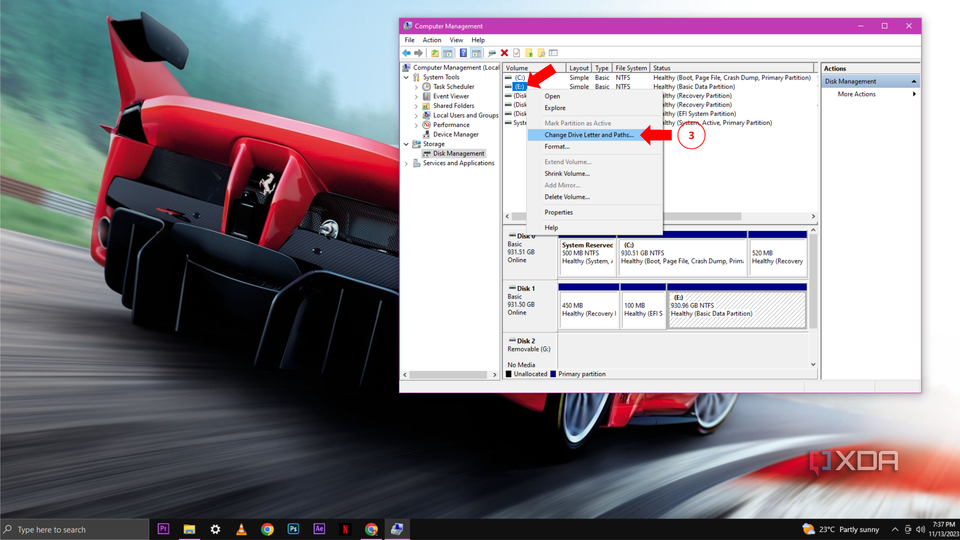 A Windows 10 desktop with the Disk Management open with the option to change drive label and paths