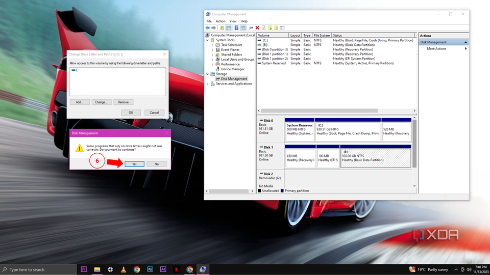 A Windows 10 desktop with the Disk Management tab open with a small warning window confirming the label change