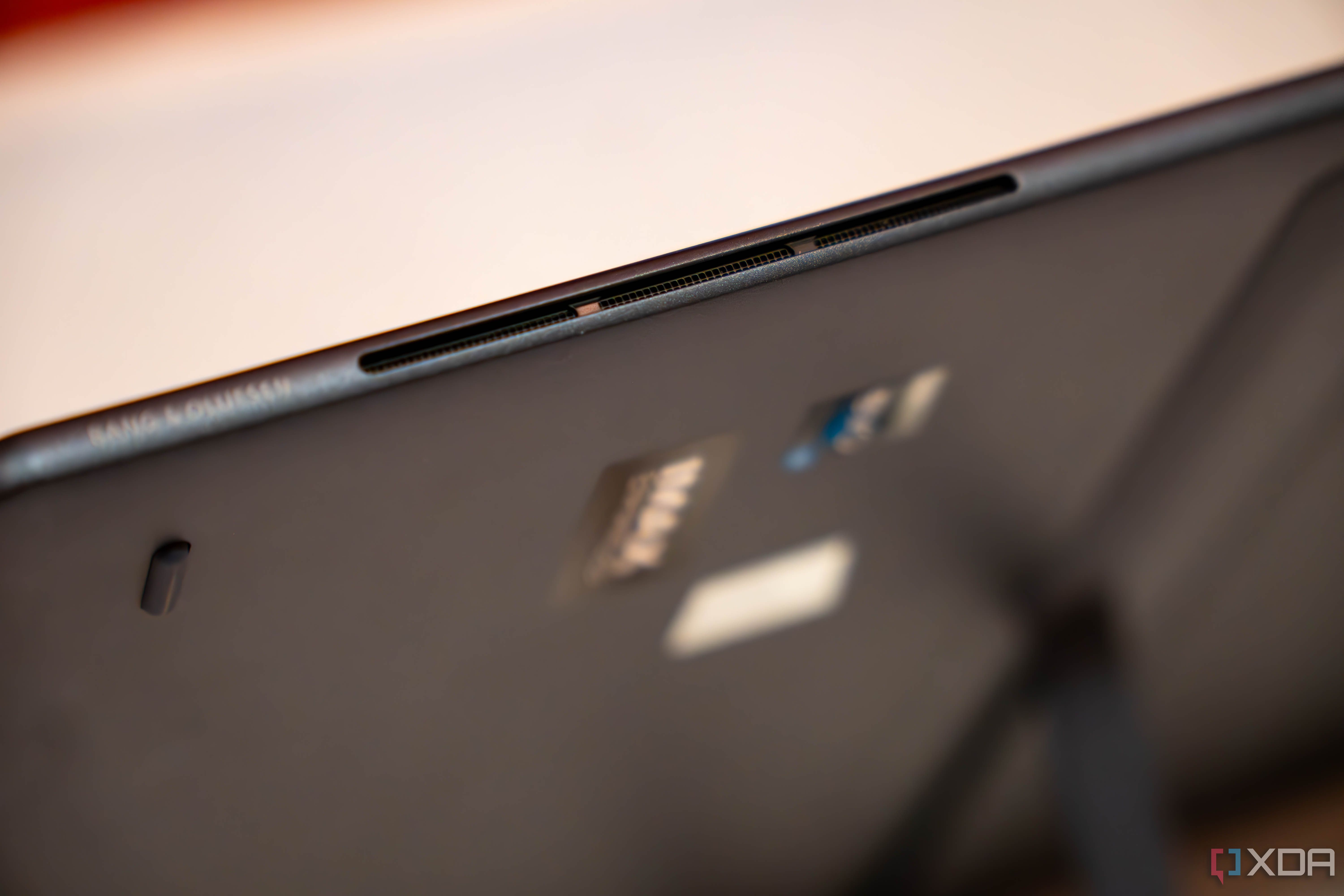Close up of speakers on a tablet with words Bang and Olufsen
