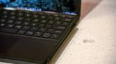 Close up of pen attached to side of keyboard