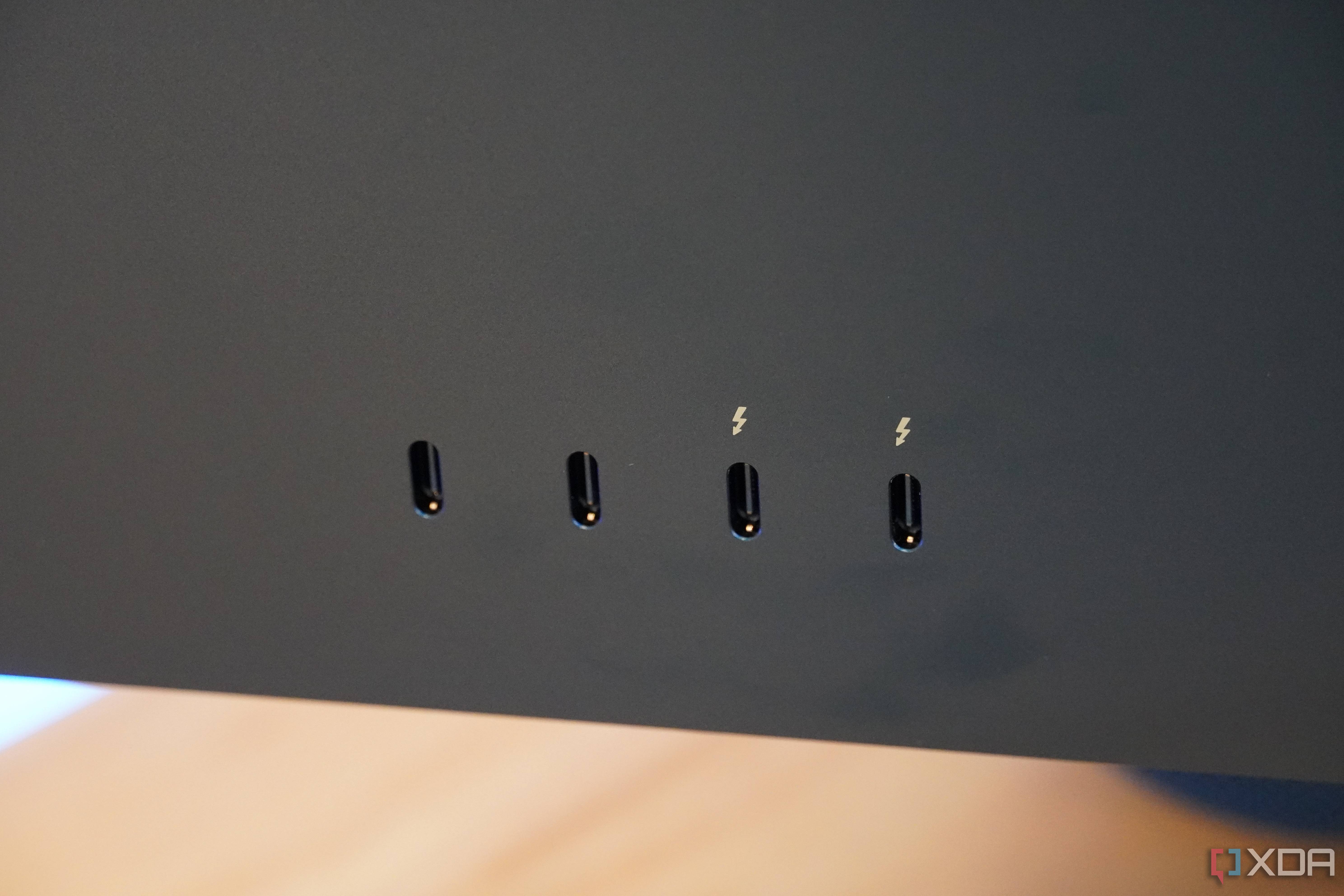 The USB-C ports and Thunderbolt ports on the back of an iMac.