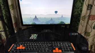 A Raspberry Pi 5 with a keyboard and mouse plugged in, with the monitor displaying the Raspberry Pi OS desktop