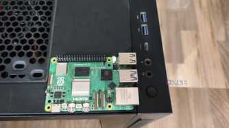A Raspberry Pi 5 placed on a Gigabyte Aorus AC300W cabinet