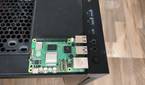 A Raspberry Pi 5 placed on a Gigabyte Aorus AC300W cabinet