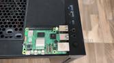 A Raspberry Pi 5 placed on a Gigabyte Aorus AC300W cabinet
