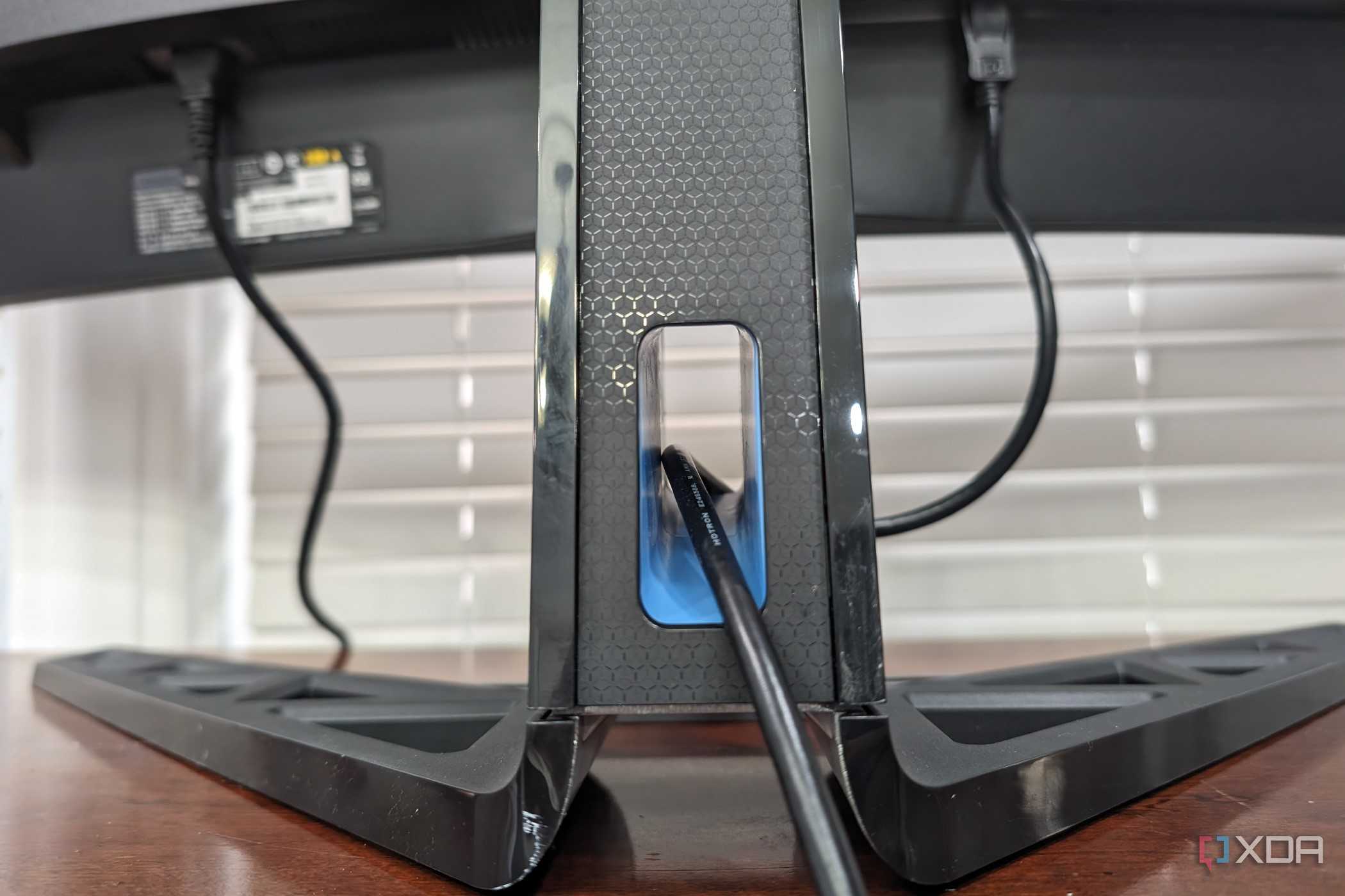 The stand on the Legion R45w-30 Monitor, with an opening for a cable