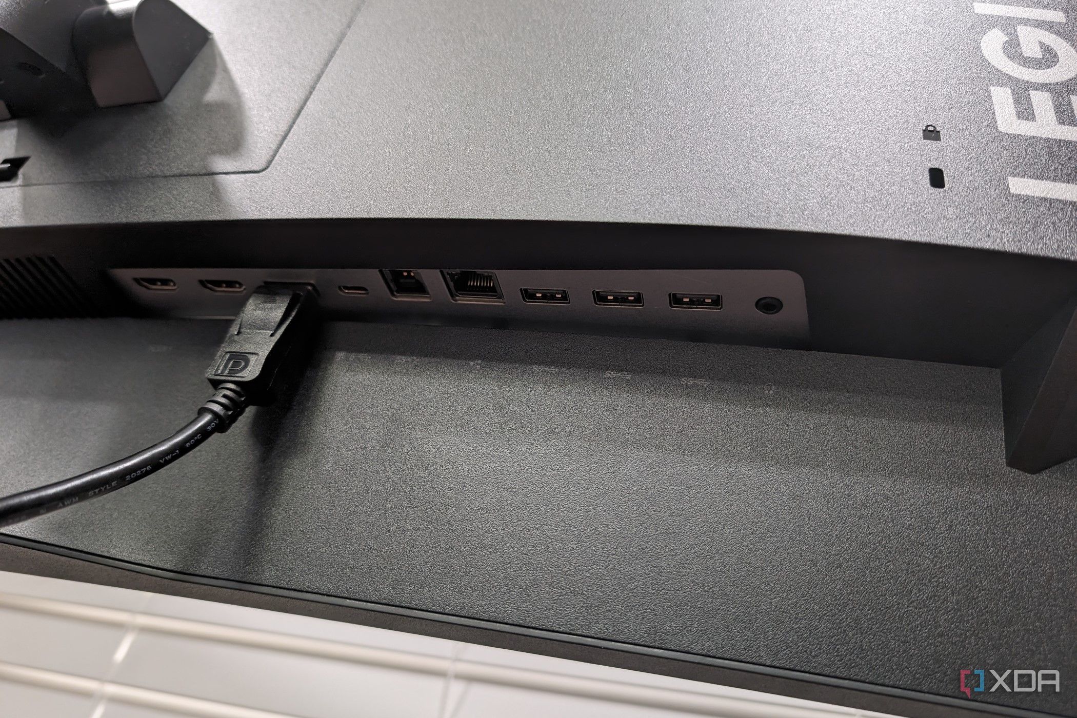 The ports on the back of the Legion R45w-30 Monitor with a DisplayPort cable connected
