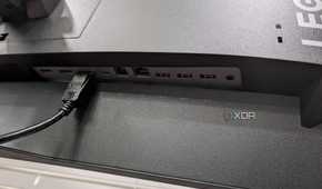 The ports on the back of the Legion R45w-30 Monitor with a DisplayPort cable connected