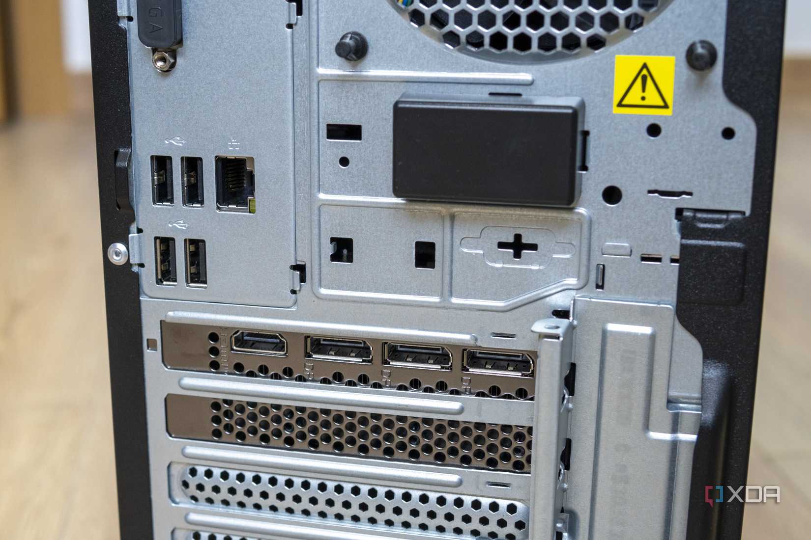Close-up view of the rear ports on the Lenovo LOQ Tower 17, including four USB ports and RJ45 Ethernet, as well as three DisplayPort ports and one HDMI port on the GPU