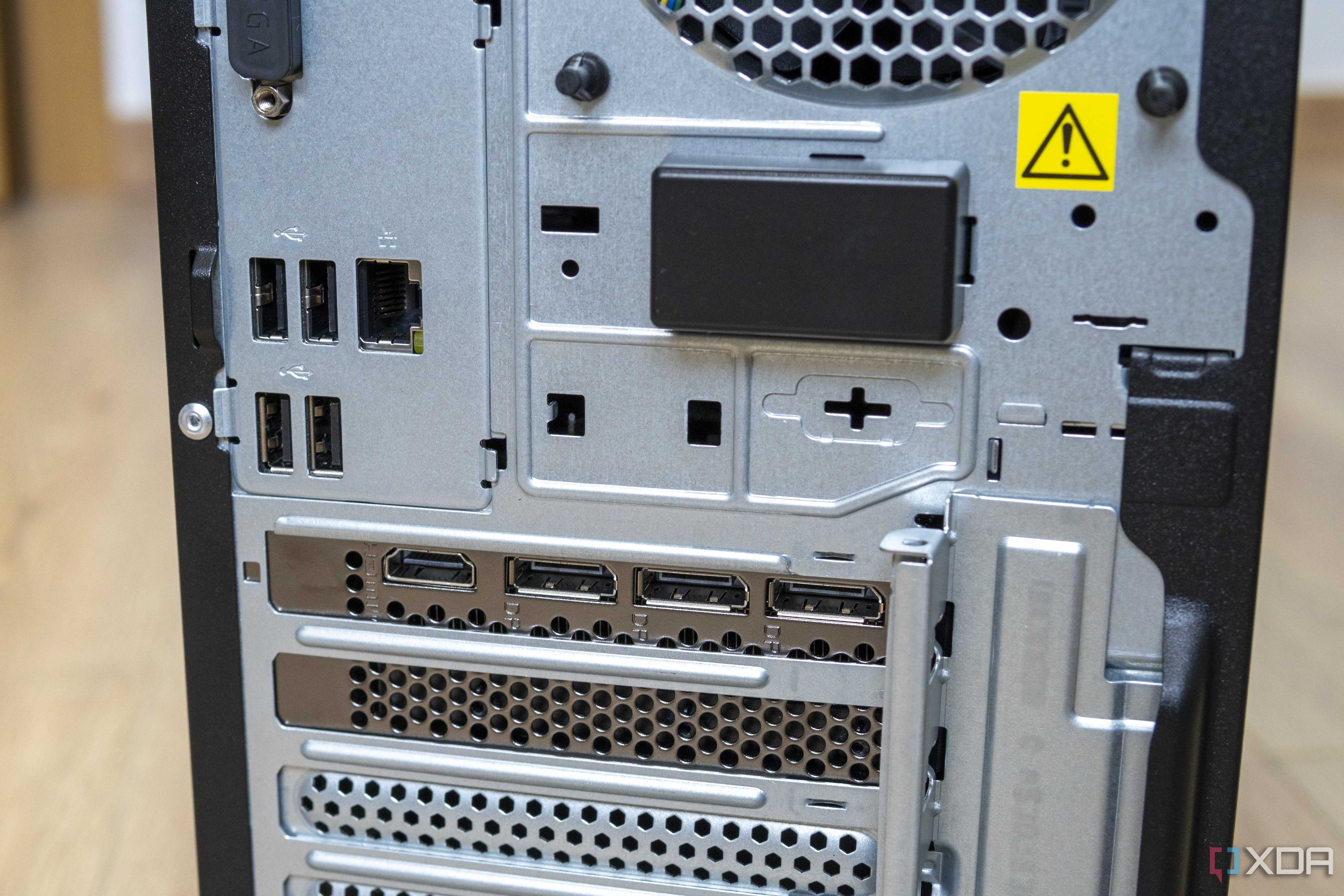 Close-up view of the rear ports on the Lenovo LOQ Tower 17, including four USB ports and RJ45 Ethernet, as well as three DisplayPort ports and one HDMI port on the GPU