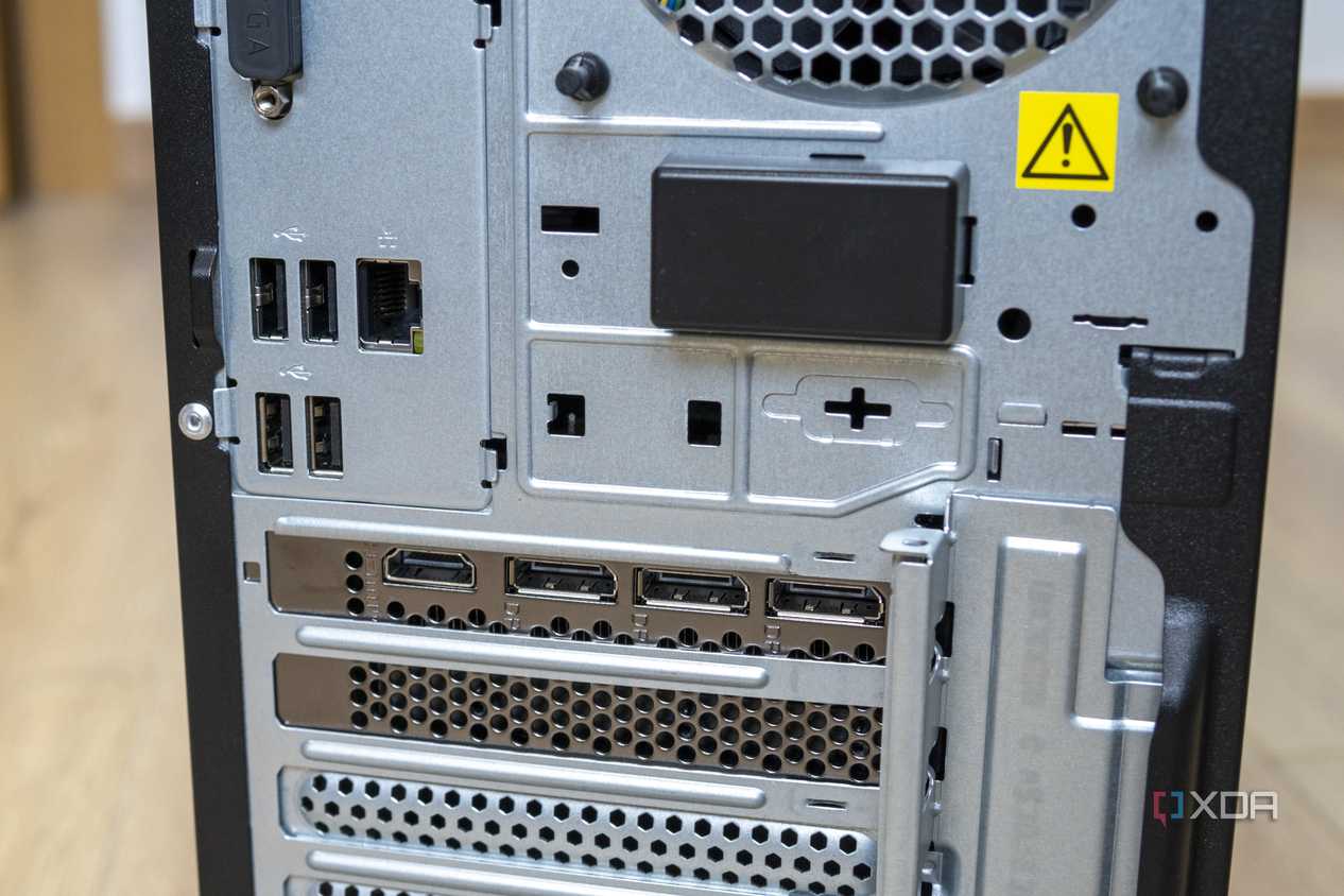 Close-up view of the rear ports on the Lenovo LOQ Tower 17, including four USB ports and RJ45 Ethernet, as well as three DisplayPort ports and one HDMI port on the GPU