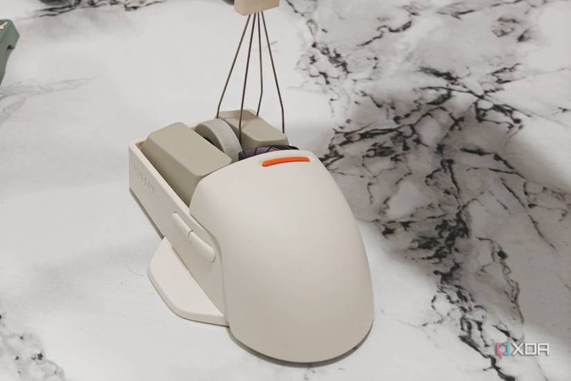 An image showing a keycap puller being used on a Lofree PBT wireless mouse.