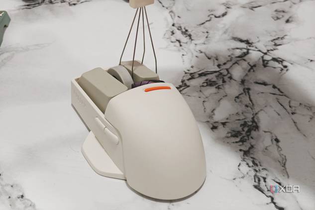 An image showing a keycap puller being used on a Lofree PBT wireless mouse.
