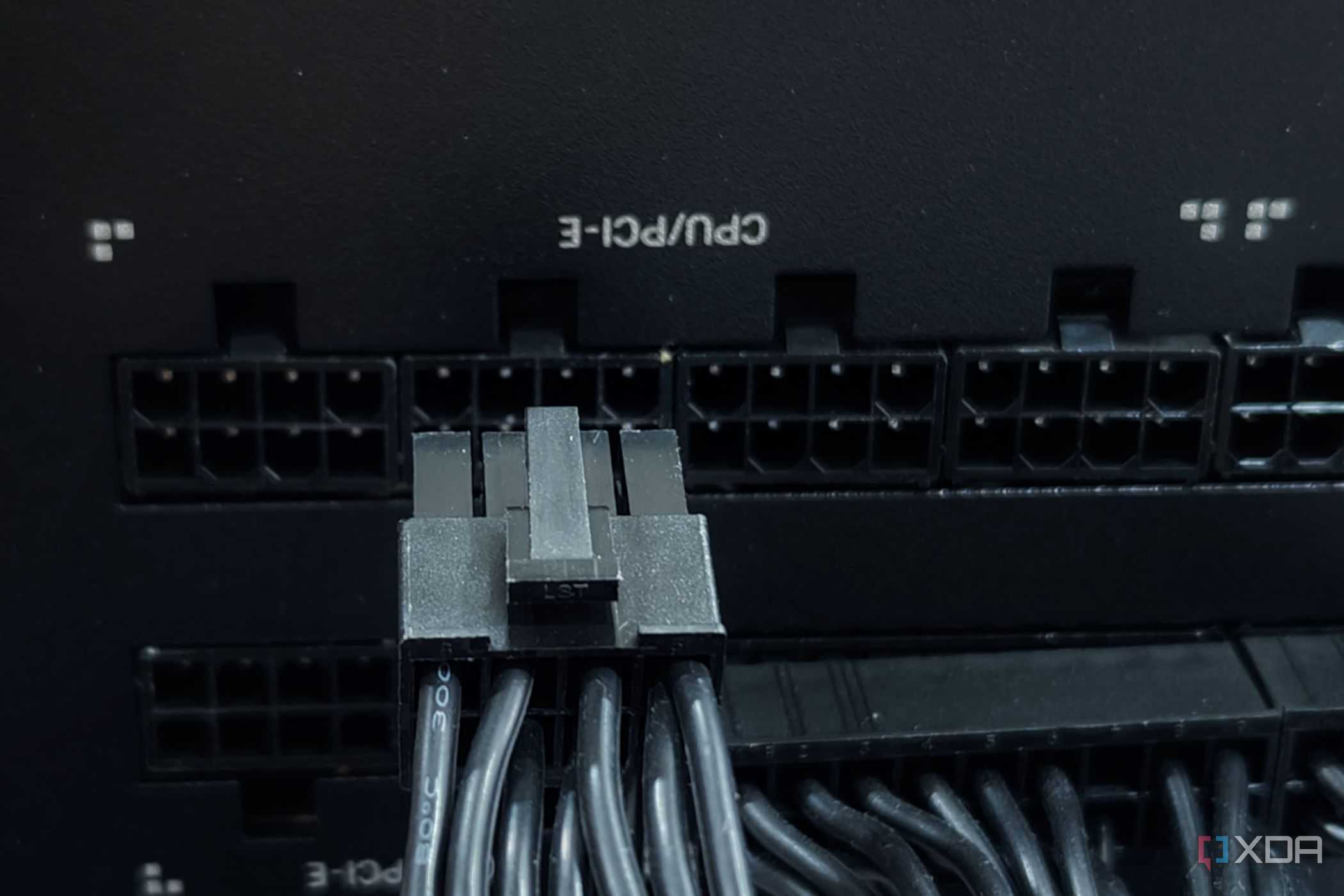 An image showing a PCIe cable being connected to the PSU.