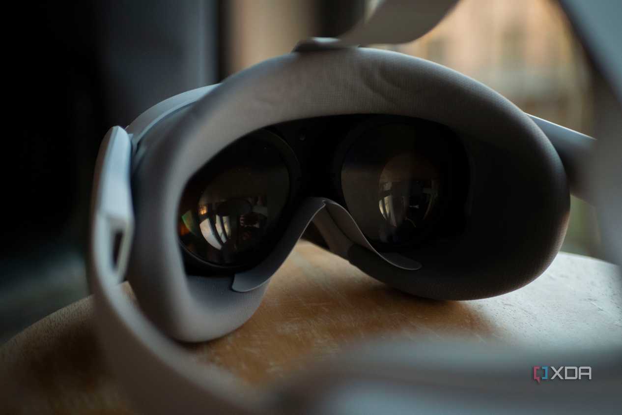 Pico 4 VR headset pancake lenses on the inside of the headset, as it rests on a stool