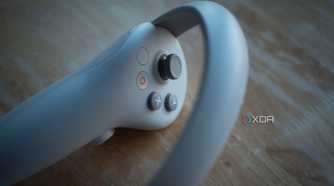 Pico 4 VR headset controller on a stool, clearly showing the buttons and joystick
