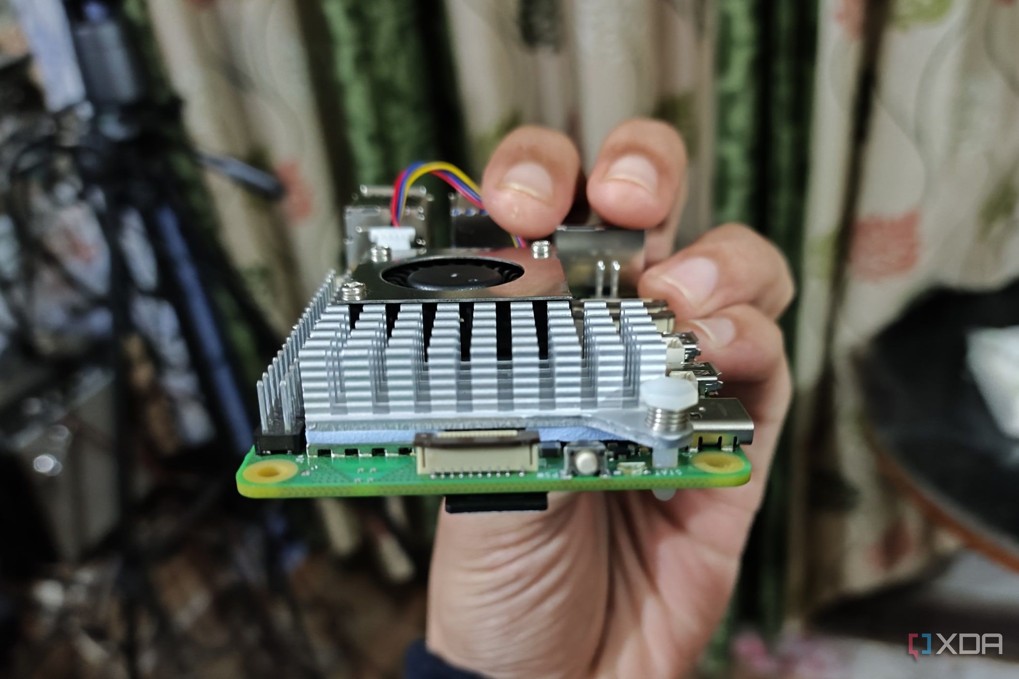 An image of the Raspberry Pi 5 with the power button and PCIe interface visible