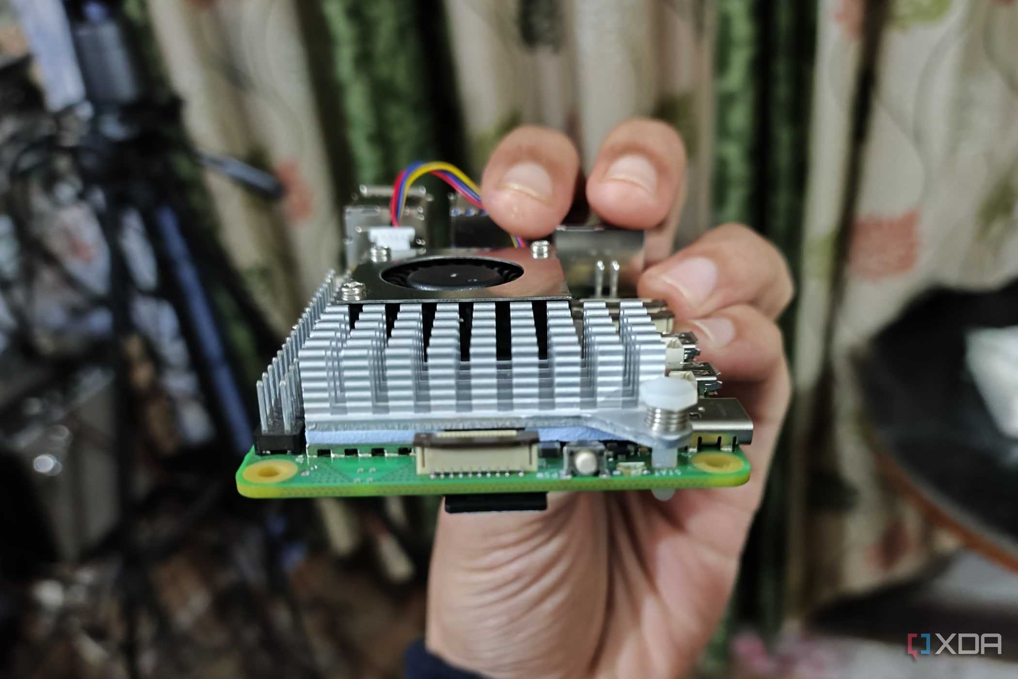 An image of the Raspberry Pi 5 with the power button and PCIe interface visible